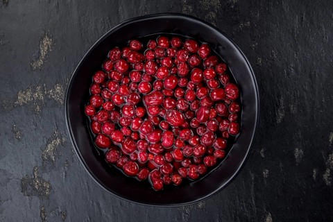 Portion of healthy Cranberries (preserved) (selective focus, close-up shot)