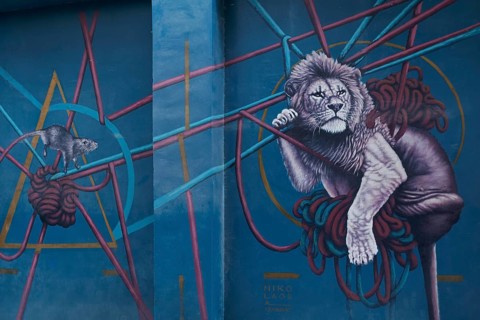 Lion and mouse hanging in ropes, mural by Greek street artist Nikolaos Tsounakas, Psirri