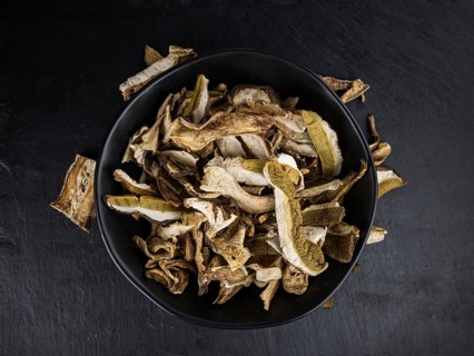 Dried Porcinis on a vintage slate slab as detailed close-up shot, selective focus