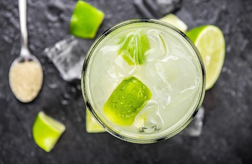 Slate slab with Caipirinha (selective focus, close-up shot)