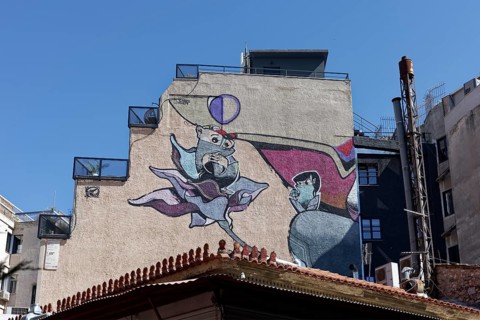 Bizarre figure growing out of a flower, surreal mural by street artist Same84 Carpe Diem, Psirri