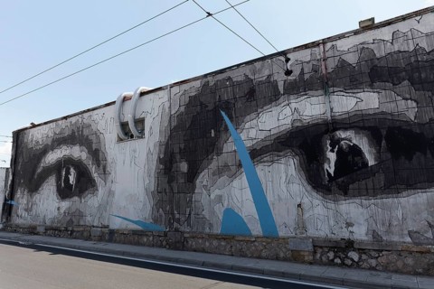 Giant pair of eyes on a wall, mural by Greek street artist INO, Gazi neighbourhood, Athens, Greece,