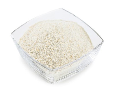 Bread Crumbs isolated on white background (selective focus, close-up shot)