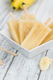 Banana Popsicles on vintage background as detailed close-up shot (selective focus)
