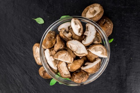 Portion of fresh Shiitake mushrooms close-up shot, selective focus