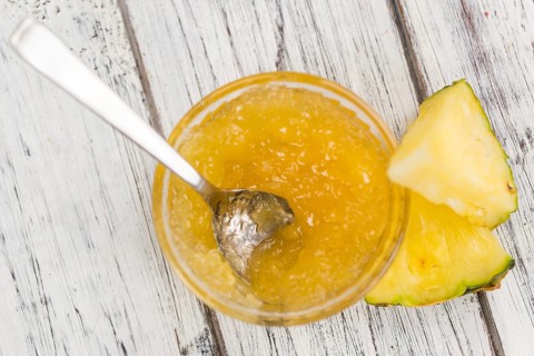 Fresh made Pineapple Jam on a vintage background as detailed close-up shot