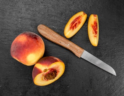 Some Peaches on a vintage slate slab, selective focus