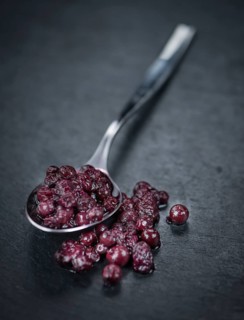 Preserved Blueberries on a vintage background as detailed close-up shot, selective focus