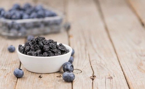 Fresh made Dried Blueberries on a vintage background as detailed close-up shot