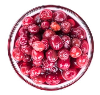 Preserved Cranberries as detailed close-up shot isolated on white background (selective focus)