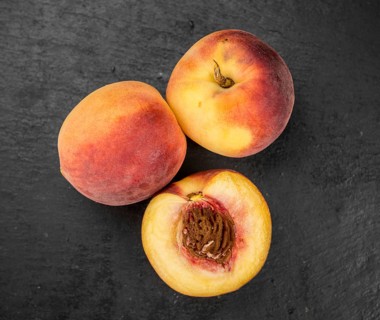 Portion of fresh Peaches close-up shot, selective focus