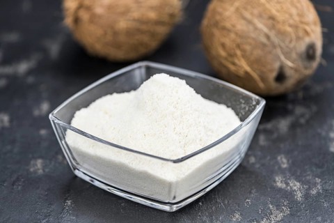 Coconut flour (fresh) as detailed close-up shot, selective focus)