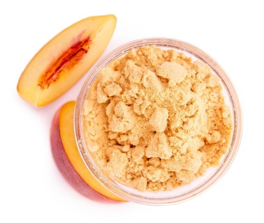 Fresh made Ground Peaches isolated on white background, close-up shot