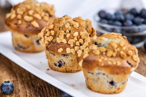 Some fresh Blueberry Muffins (selective focus, close-up shot)