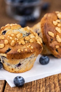 Fresh Blueberry Muffins as detailed close-up shot (selective focus)