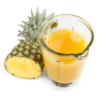 Fresh made Pineapple Juice isolated on white background, close-up shot