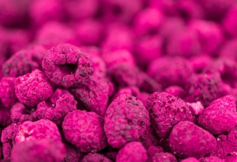 Dried Raspberries on a vintage background as detailed close-up shot, selective focus
