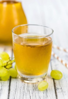 Some healthy Grape Juice (selective focus, close-up shot)