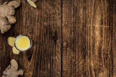 Portion of fresh Ginger Juice (selective focus, close-up shot)