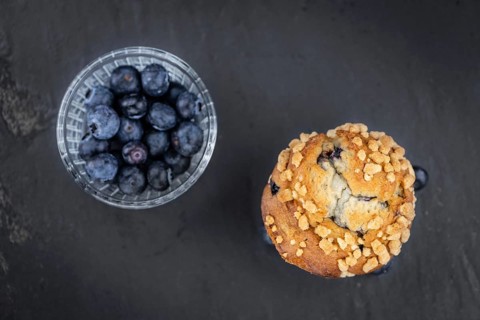 Fresh Blueberry Muffins as detailed close-up shot (selective focus)