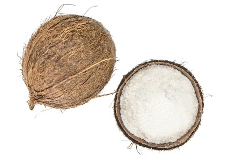 Coconut flour as detailed close-up shot isolated on white background (selective focus)
