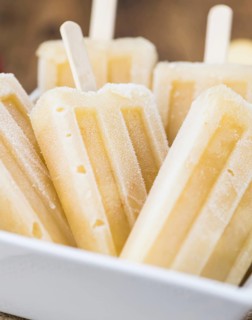Fresh made Apple Popsicles (selective focus, close-up shot) on a vintage background