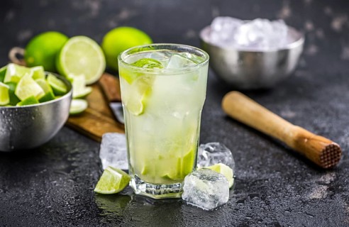 Slate slab with Caipirinha (selective focus, close-up shot)