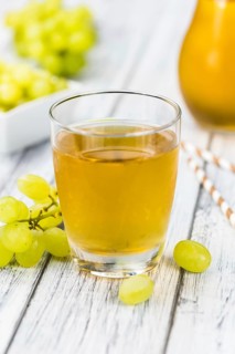 Some healthy Grape Juice (selective focus, close-up shot)