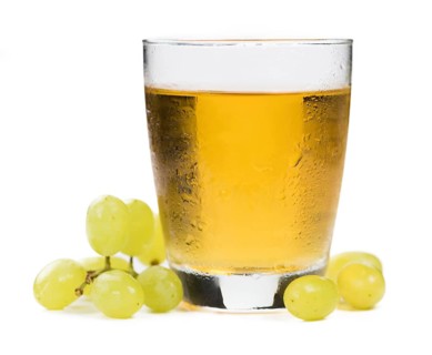 Grape Juice isolated on white background (selective focus, close-up shot)