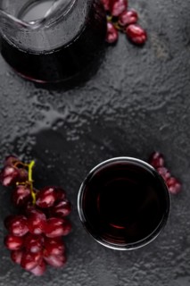 Some fresh Red Grape Juice (selective focus, close-up shot)