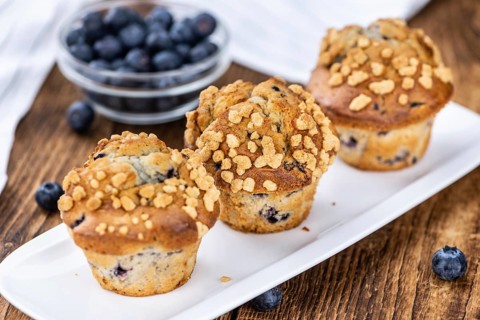 Fresh Blueberry Muffins as detailed close-up shot (selective focus)