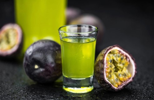 Passion Fruit Liqueur (fresh made) as detailed close-up shot, selective focus