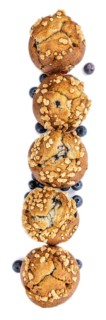 Blueberry Muffins isolated on white background (selective focus, close-up shot)