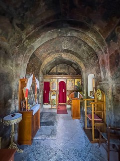 Interior with antique frescoes in the historic small single-nave church Panagia Throniotissa Naos