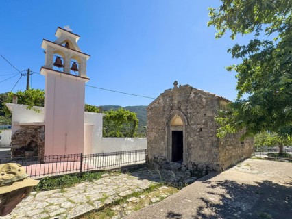 On the left, separate new bell tower on the right, historic small single-nave church of Panagia