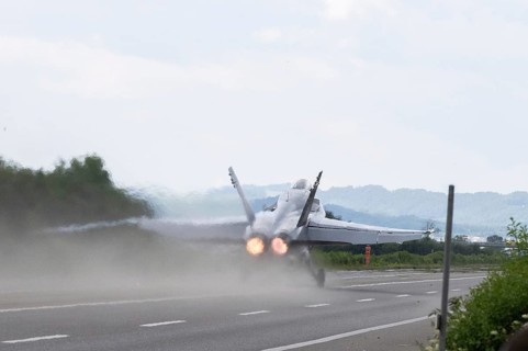 Swiss Air Force F/A 18 fighter aircraft take off and land on the A1 motorway during the Alpha Uno