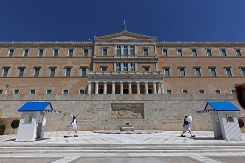 Parliament building with Evzones in traditional dress, blue sky, Athens, Greece, Europe