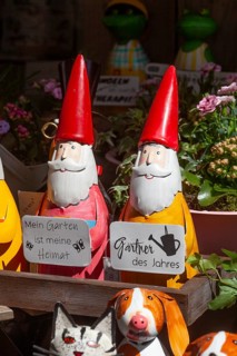 Colourful garden gnomes in front of a shop, Leer, East Frisia, Germany, Europe