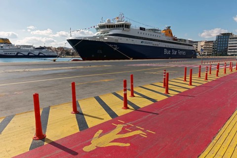 Ferry to the island of Paros of the Blue Star Line, marked pedestrian path at the quay, Piraeus