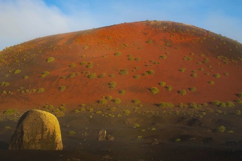 Lava bomb in front of Caldera Colorada, Parque Natural de Los Volcanes, near Masdache, Lanzarote,