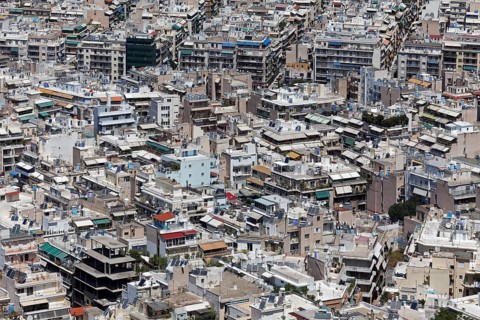 View of densely built-up metropolis, sea of houses without greenery, symbolic image concrete