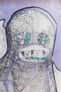 Creepy creature with sharp teeth, ghost figure, street art in the Anafiotika neighbourhood, Athens,