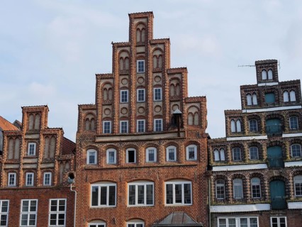 Historic building with striking faÃ§ade and red brick walls, radiates architectural uniqueness,