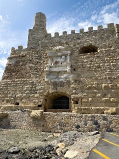 View from the harbour entrance to the sea-side outer wall of a fortress built in the Middle Ages