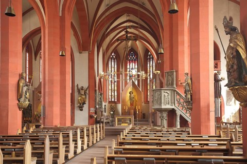 Interior view with figures and pulpit of late Romanesque St Andrew's Church, Karlstadt, Bavaria,