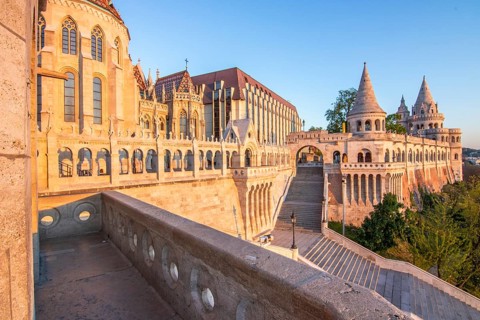 Old historic fortress and church at sunrise. City panorama at dusk. View of the Danube Fishermen's