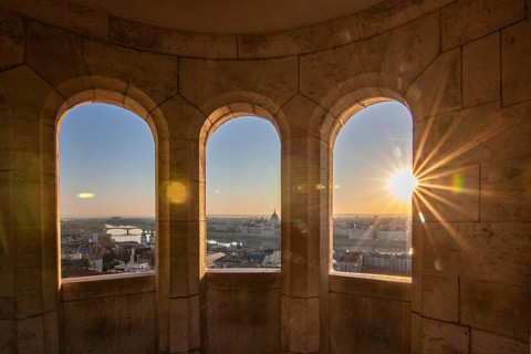 Old historic fortress and church at sunrise. City panorama at dusk. View of the Danube Fishermen's