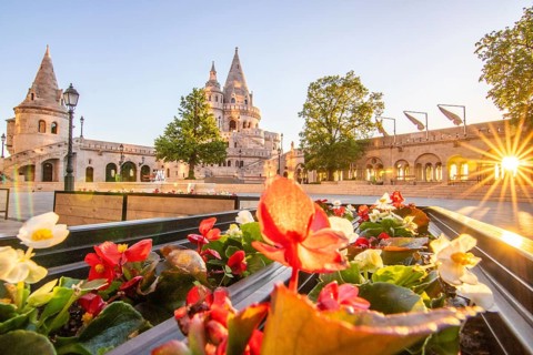 Old historic fortress and church at sunrise. City panorama at dusk. View of the Danube Fishermen's