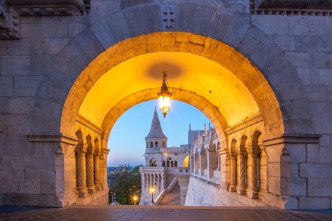 Old historic fortress and church at sunrise. City panorama at dusk. View of the Danube Fishermen's