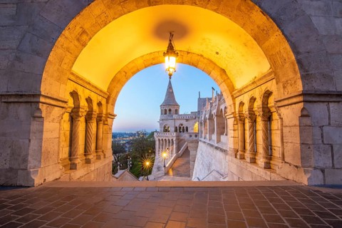 Old historic fortress and church at sunrise. City panorama at dusk. View of the Danube Fishermen's